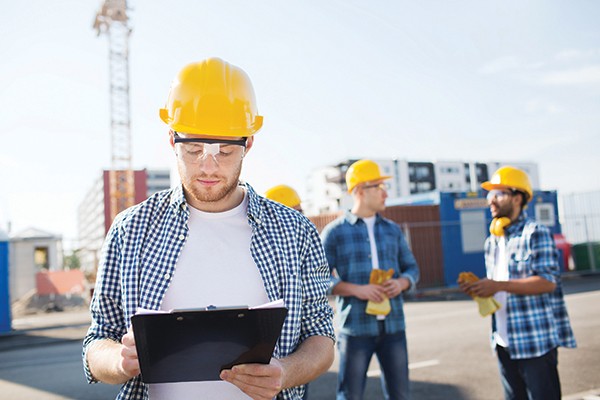 group of builders in hardhats outdoors